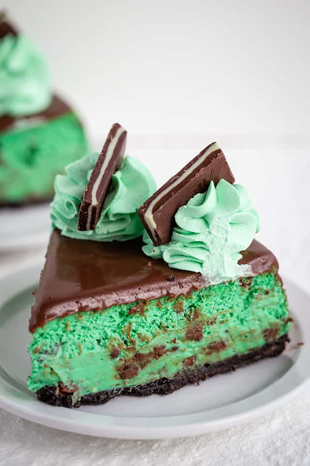 slice of mint chocolate cheesecake on white plate